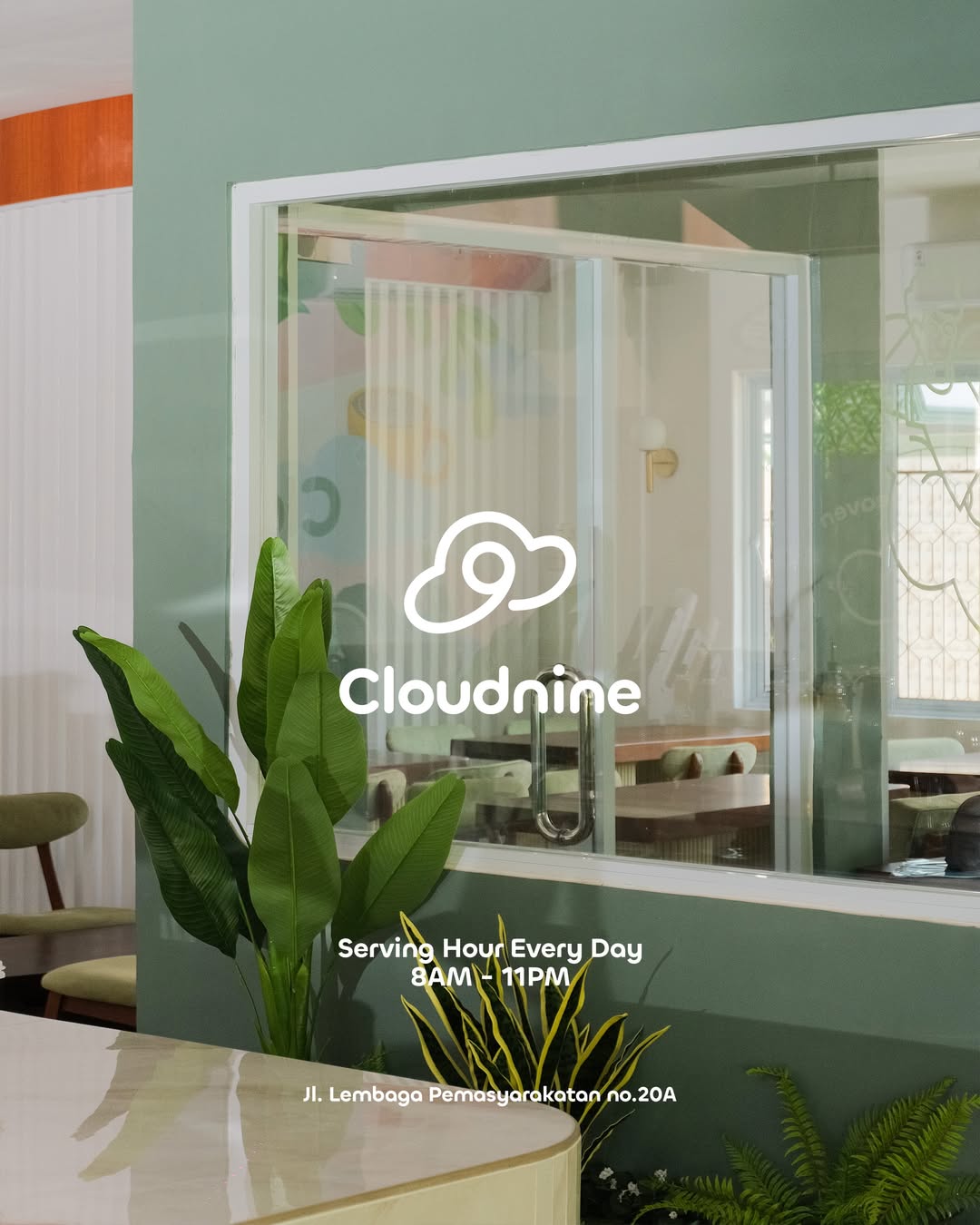 Cloudnine Space exterior view — modern sage green facade with indoor plants
